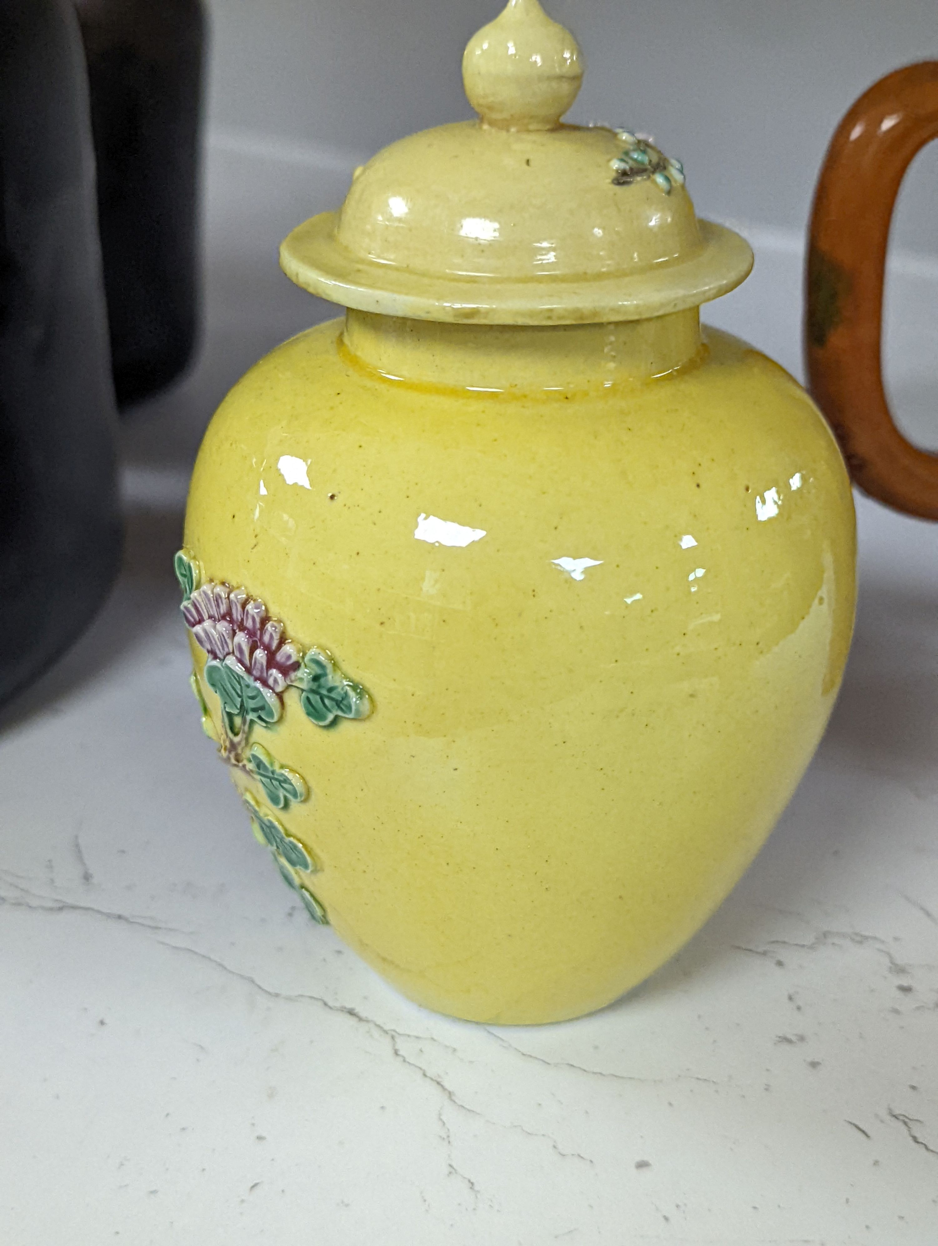 A Chinese enamelled yellow-ground jar and cover, a pottery teapot and cover and a flambe vase, latter 13cm